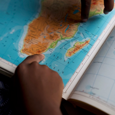 A child studying an atlas