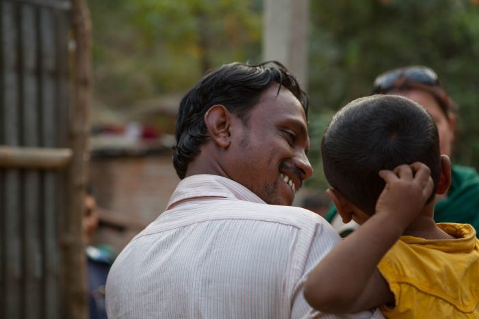 A Bangladeshi father and son share a moment of joy