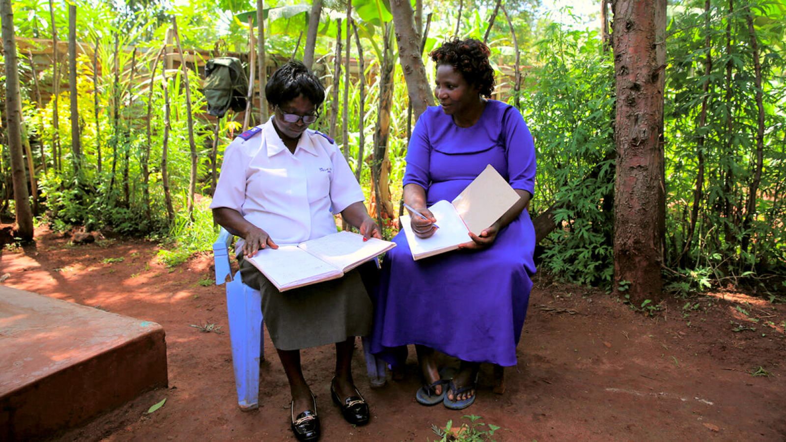 Rose and Gladys with workbooks - Kenya