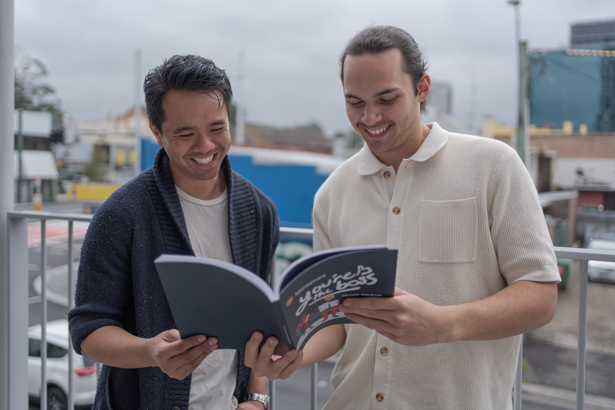 Header image of two smiling individuals reading You're the Boss booklet