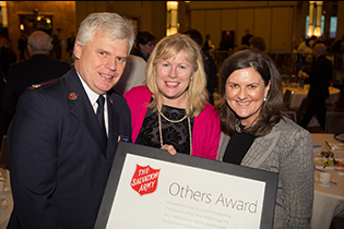 Above image: Major Neil Venables, Territorial Communications and Fundraising Secretary, and Joanne Cameron, Chairman of the Territorial Advisory Board, present the 'Others' award to Tracie Walker, General Manager, Kmart Corporate Affairs and Sustainability.